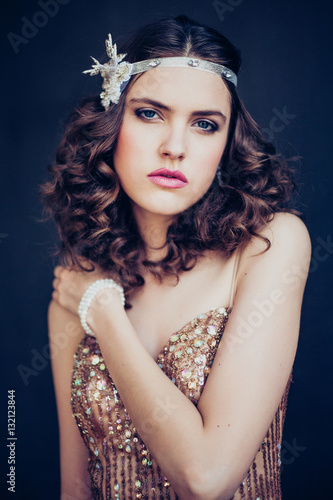 Fashion photo of beautiful girl wearing sparkling evening dress