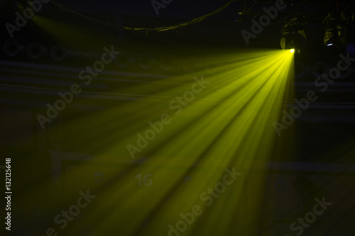 Shining led spotlights at concert with foggy background