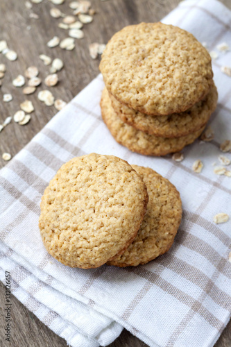 Homemade oatmeal cookies on checkered kitchen towel