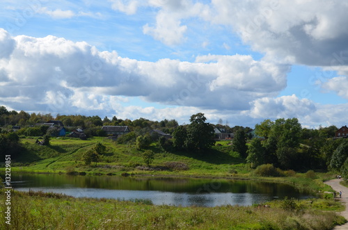 Lake view on the background of blue sky with clouds