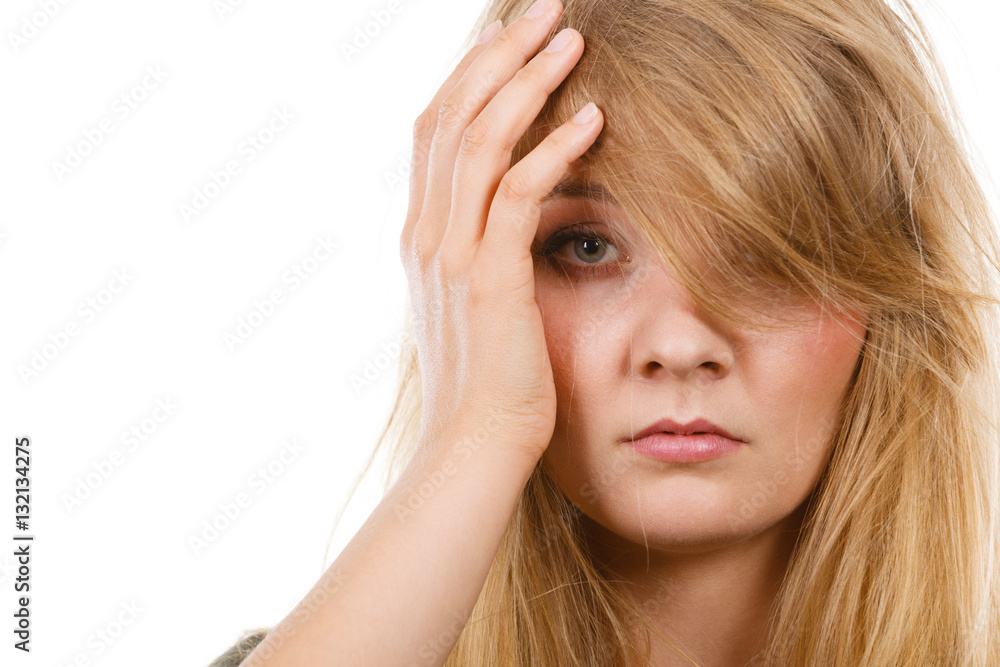 Woman having headache putting hand on head Woman having headache putting hand on head