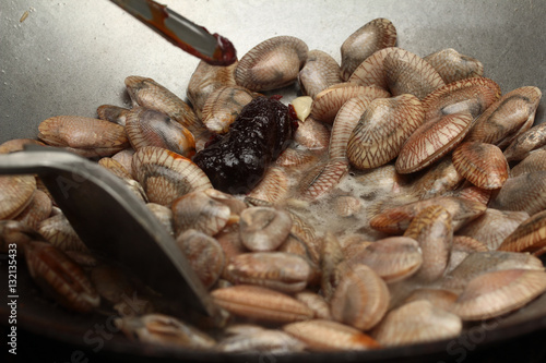 Cooking , Stir fried clams with roasted chile paste.