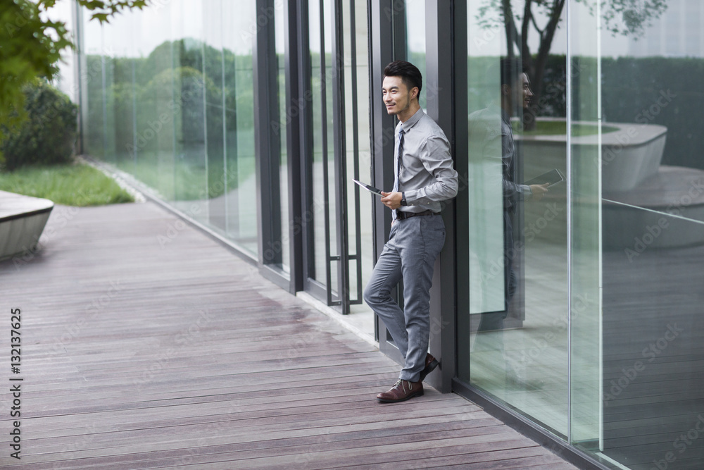 Businessman holding a digital tablet Businessman holding a digital tablet