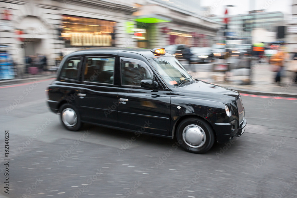 London black cab taxi in motion on the street
