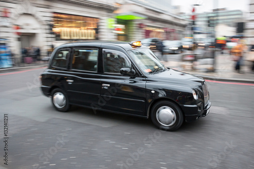Canvas Print London black cab taxi in motion on the street