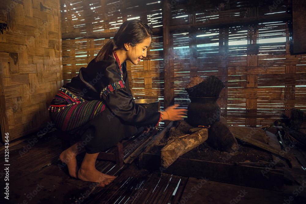 Asian woman cooking at house in rural of Thailand