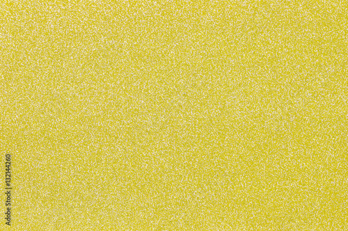 Closeup surface beautiful yellow gift wrapping paper textured background photo