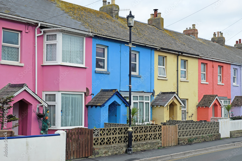 A section of colorful terraced housing in a west country seaside town, England