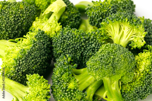 Broccoli heads on a white background.
