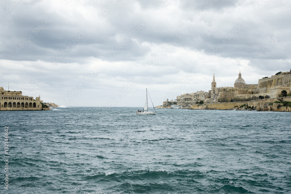 Sail boat navigating at Marsamxett Harbor, Malta
