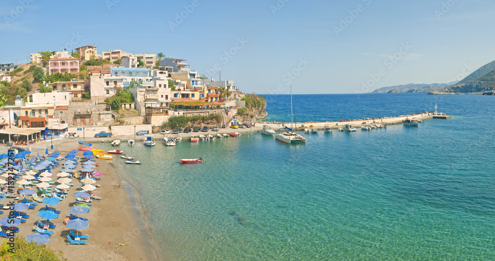 beach and small port on sunny day panorama