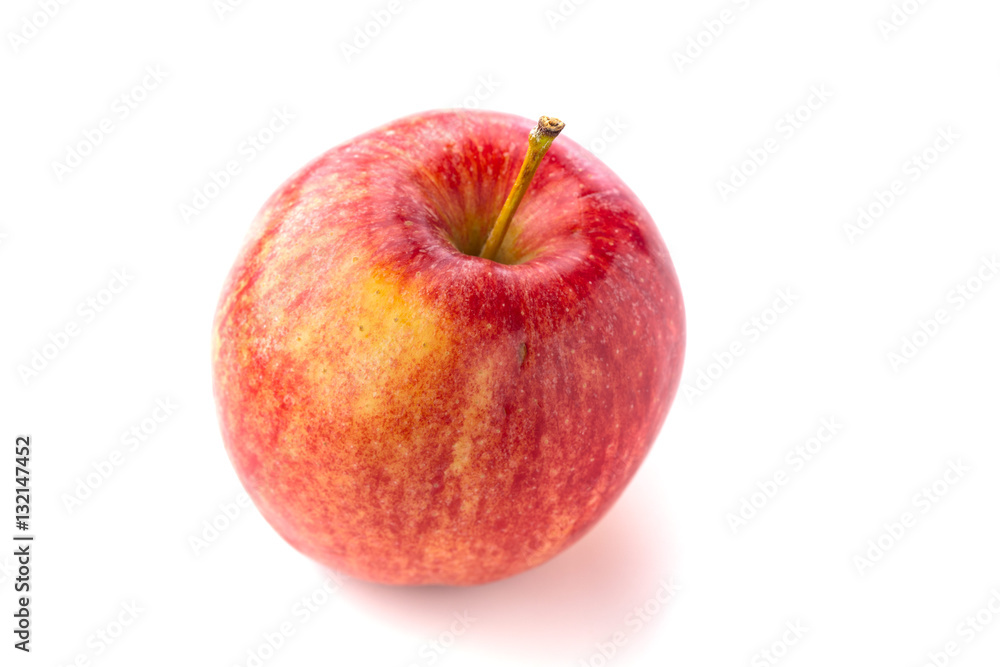 Shot from above of a ripe red juicy macintosh apple with a stem on a bright background Shot from above of a ripe red juicy macintosh apple with a stem on a bright background