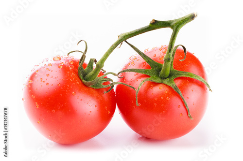 Wallpaper Mural Two fresh round red tomatoes on a green stem with water droplets on a white background Torontodigital.ca