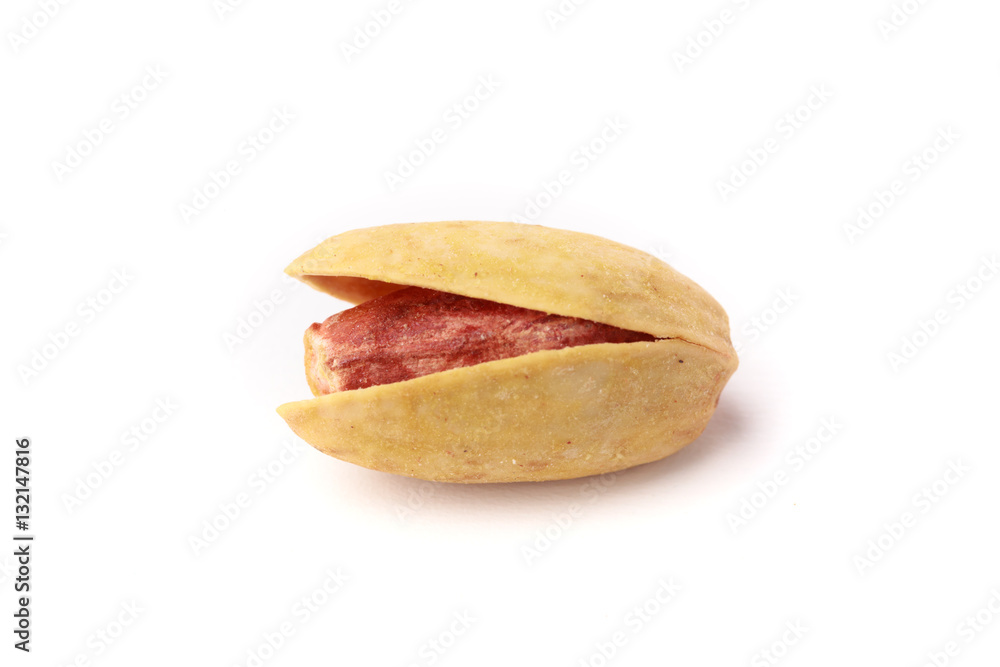 Single closeup isolated pistachio nut with its shell on a white background Single closeup isolated pistachio nut with its shell on a white background