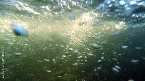 
Underwater in a river bubbles blowing in the direction of camera