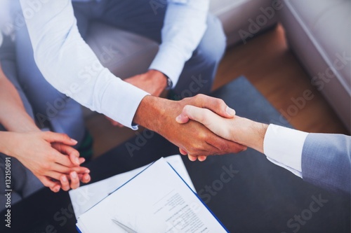 Salesman shaking hands with client