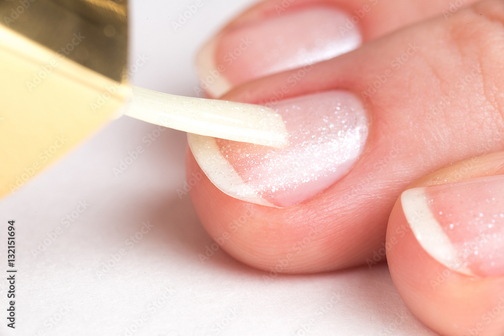 master of manicure covers customer nails clear varnish with sparkles master of manicure covers customer nails clear varnish with sparkles
