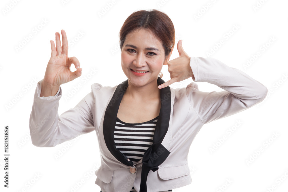 Young Asian woman show with phone gesture and OK sign. Young Asian woman show with phone gesture and OK sign.