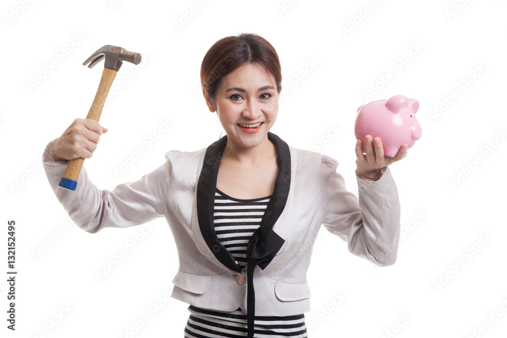 Asian business woman with pig coin bank and hammer. Asian business woman with pig coin bank and hammer.