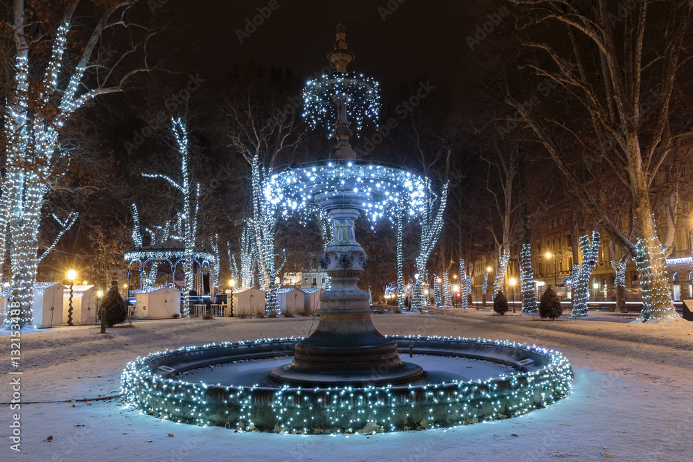Fototapeta premium Zrinjevac park Fountain decorated by Christmas lights as part of Advent in Zagreb. Fountain is known as The Mushroom.
