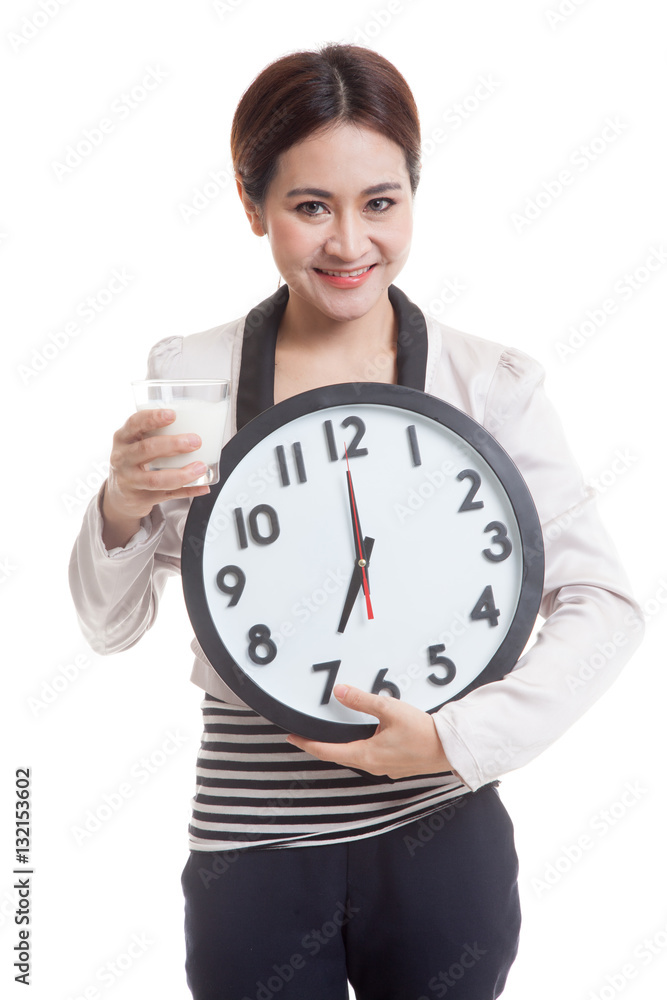 Healthy Asian woman drinking glass of milk hold clock. Healthy Asian woman drinking glass of milk hold clock.