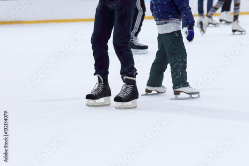 people skating on the ice rink