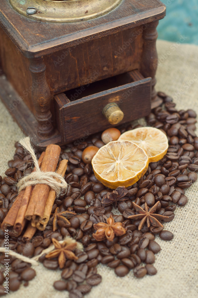 Manual coffee grinder. Cinnamon, star anise and coffee beans