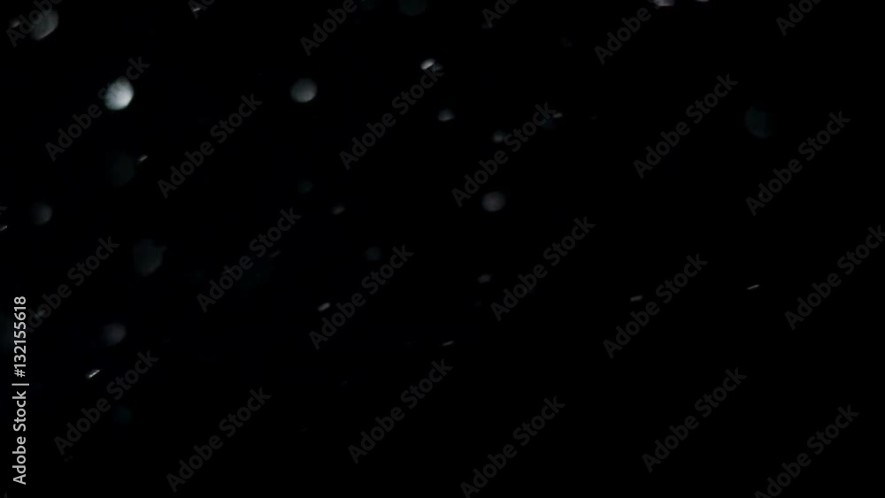 abstract black background with white dust particles moving chaotically abstract black background with white dust particles moving chaotically