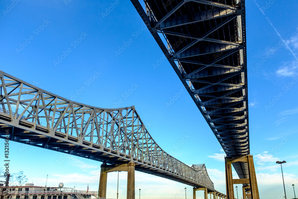 view of the Crescent City Connection, formerly the Greater New Orleans Bridge. It comprises twin cantilever bridges that carry U.S. Route 90 Business over Mississippi River in New Orleans, Louisiana