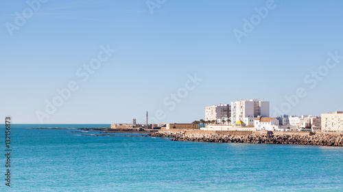 Cadiz Waterfront.  A view of the Cadiz waterfront in Spain with the Castillo de San Sebastian in the background. © ATGImages