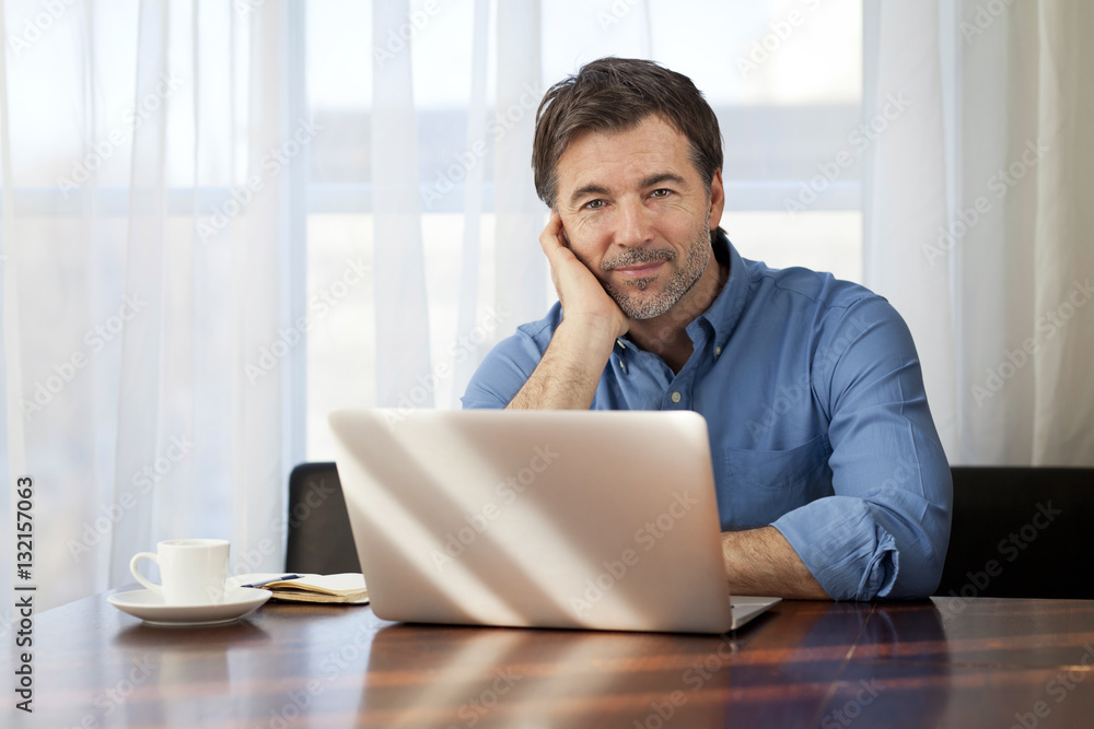 Handsome Man working At Home On His Laptop Handsome Man working At Home On His Laptop