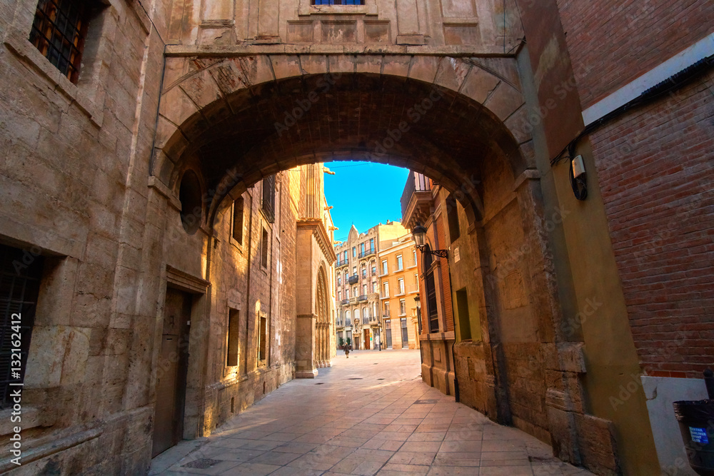 Valencia Spain Narrow Street with Arch Bridge