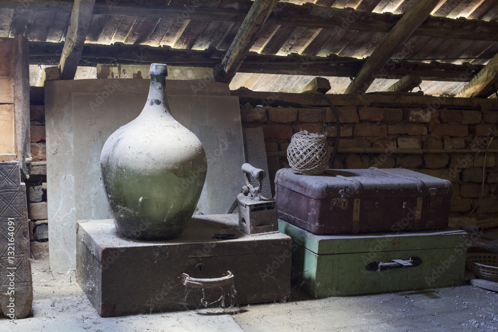 Glass, wooden and metallic objects in the attic with dust and spiderwebs in a beautiful, moody light
Glass, wooden and metallic objects in the attic with dust and spiderwebs in a beautiful, moody light