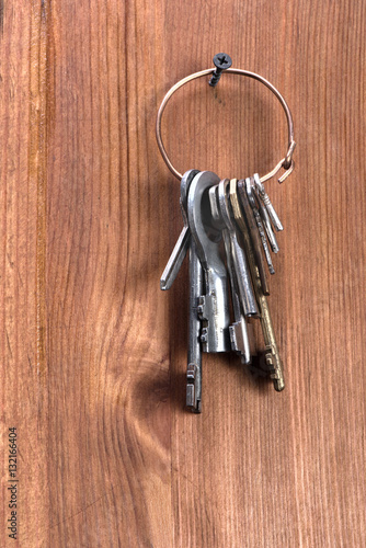 keys hanging on a wooden wall