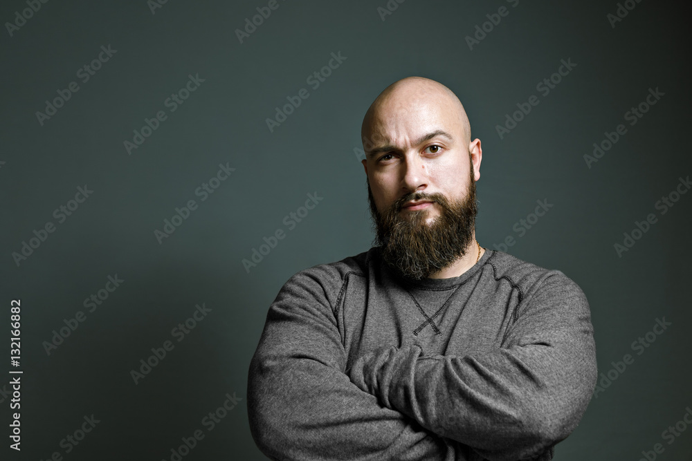 brutal bald man with a beard