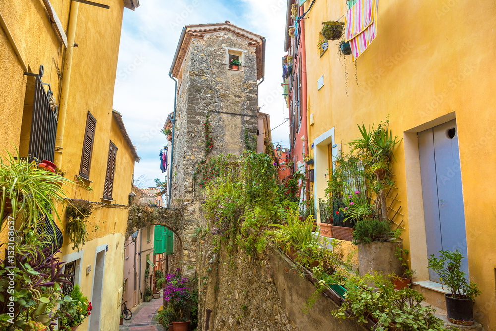 Fototapeta premium Old narrow street in Menton, France