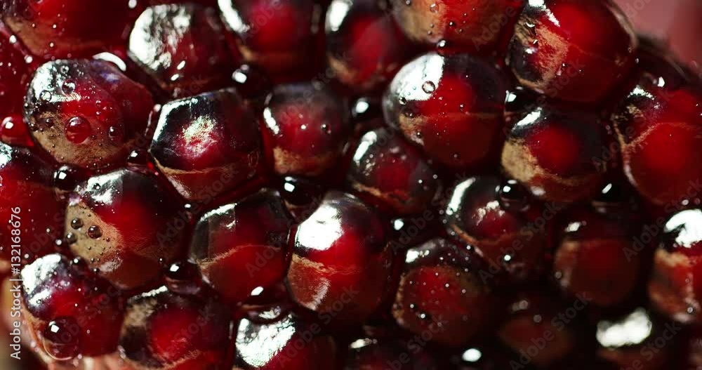 Extreme macro of juicy pomegranate, rich in natural antioxidants. concept of red fruits, vitamins and natural antioxidants to the skin for beauty. Extreme macro of juicy pomegranate, rich in natural antioxidants. concept of red fruits, vitamins and natural antioxidants to the skin for beauty.