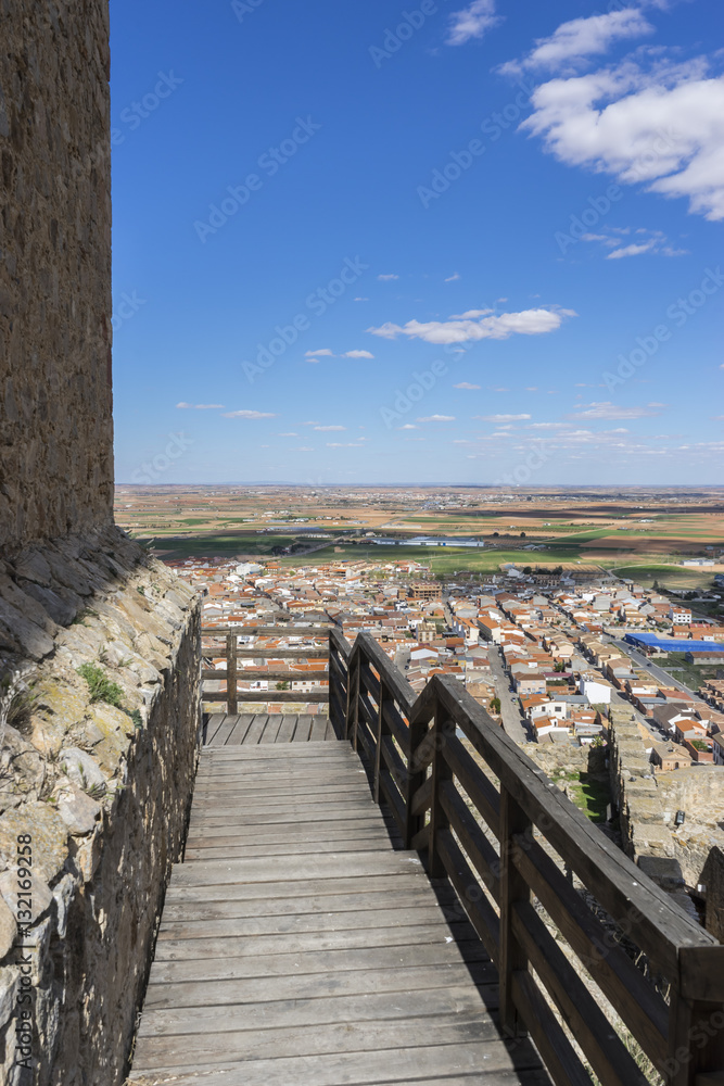 Wooden stairs in a medieval castle. Town of Consuegra in the pro