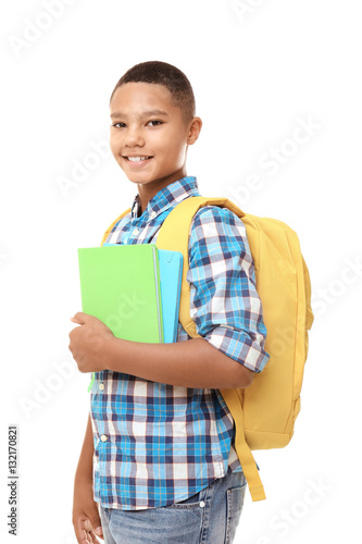 Cheerful teenager boy holdi...