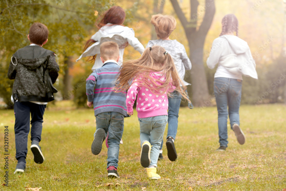 Sporty children running in the park Sporty children running in the park