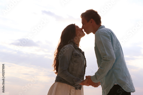 Beautiful young couple outd...