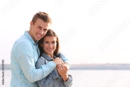 Beautiful young couple near...