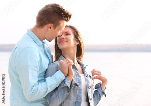 Beautiful young couple near...