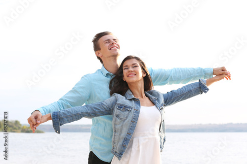 Beautiful young couple near...