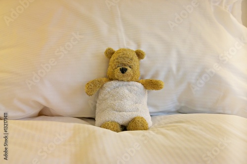 Bear is sick in bed