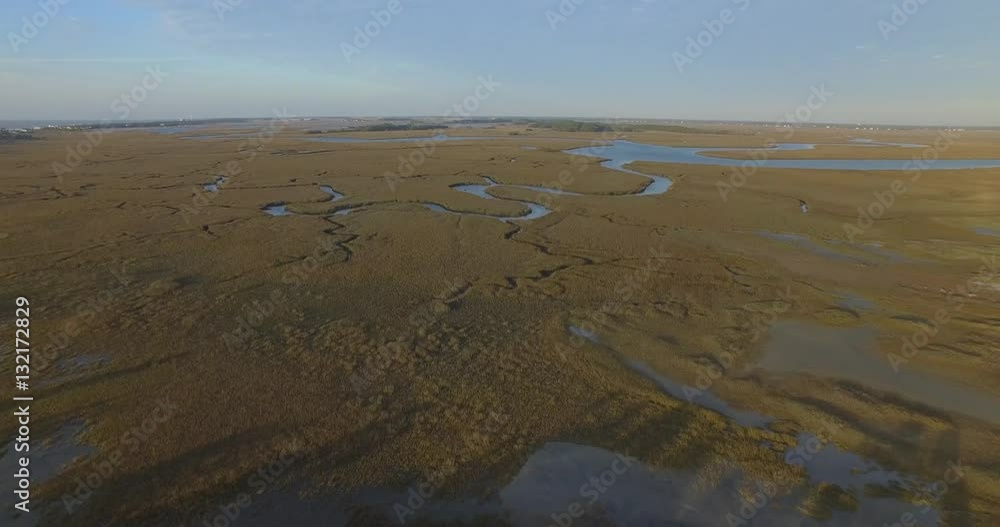 Aerial shot of a coastal salt marsh creek on Folly Beach in South Carolina. Aerial shot of a coastal salt marsh creek on Folly Beach in South Carolina.