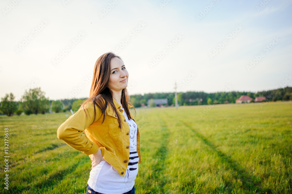 Happy young girl enjoying the beauty of sunny spring day Happy young girl enjoying the beauty of sunny spring day