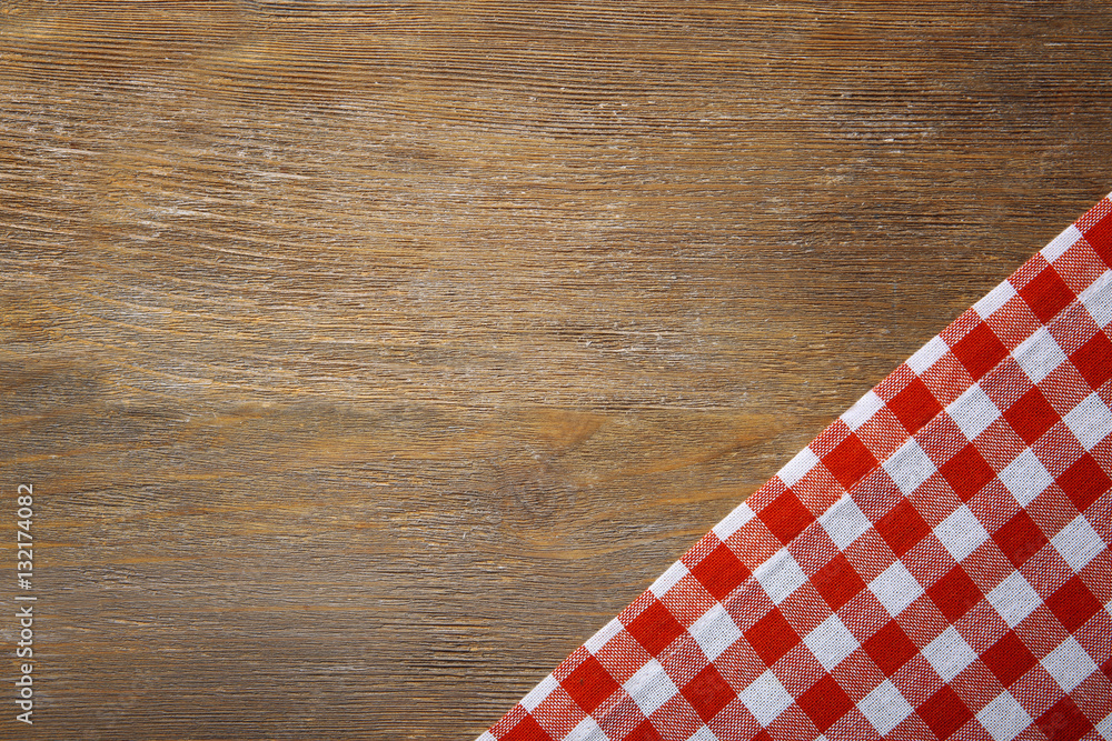 Red napkin on wooden table Red napkin on wooden table