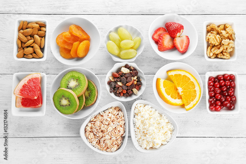 Wallpaper Mural Set of diet products in saucers on wooden background Torontodigital.ca