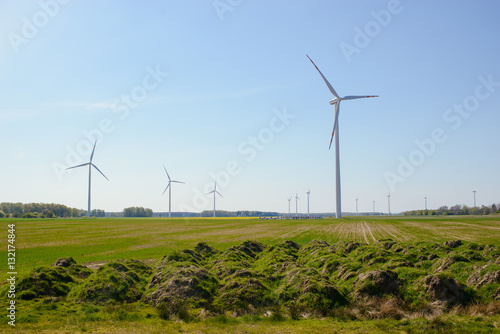 Bright blue sky moving and wind turbine